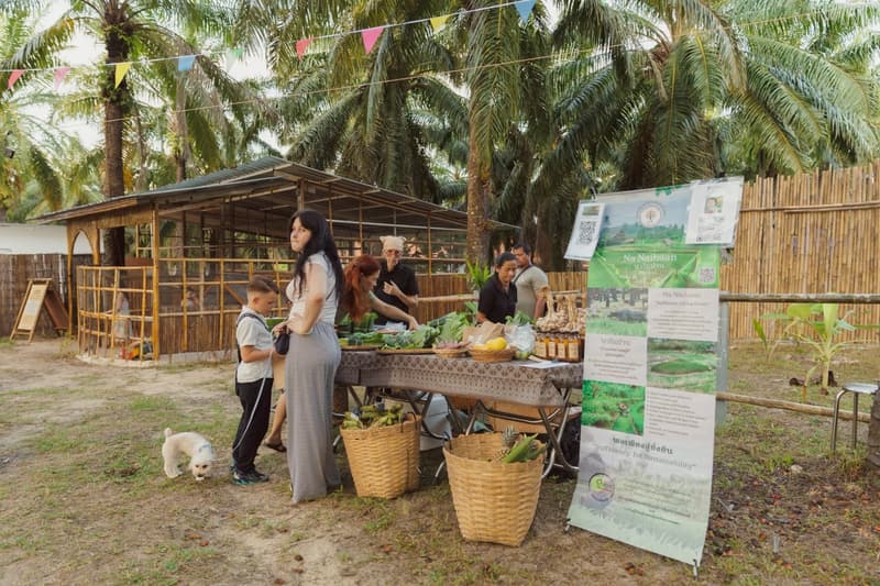 A local farm stall with fresh vegetables in woven baskets