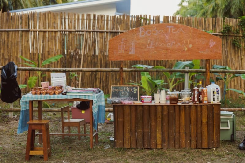 A wooden stall with homemade lemonade and boba tea
